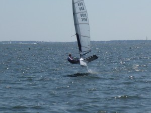 Moth Sailboat flying/sailing through the water