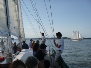 Schooner Woodwind sailing past the AJ Meerwald in Annapolis