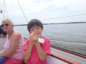 Emilio showing off his newly lost tooth on the Schooner Woodwind.