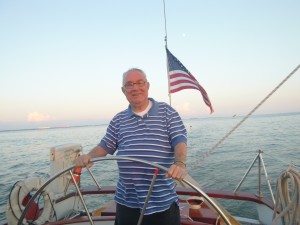 Fr. Al Olive steering Schooner Woodwind