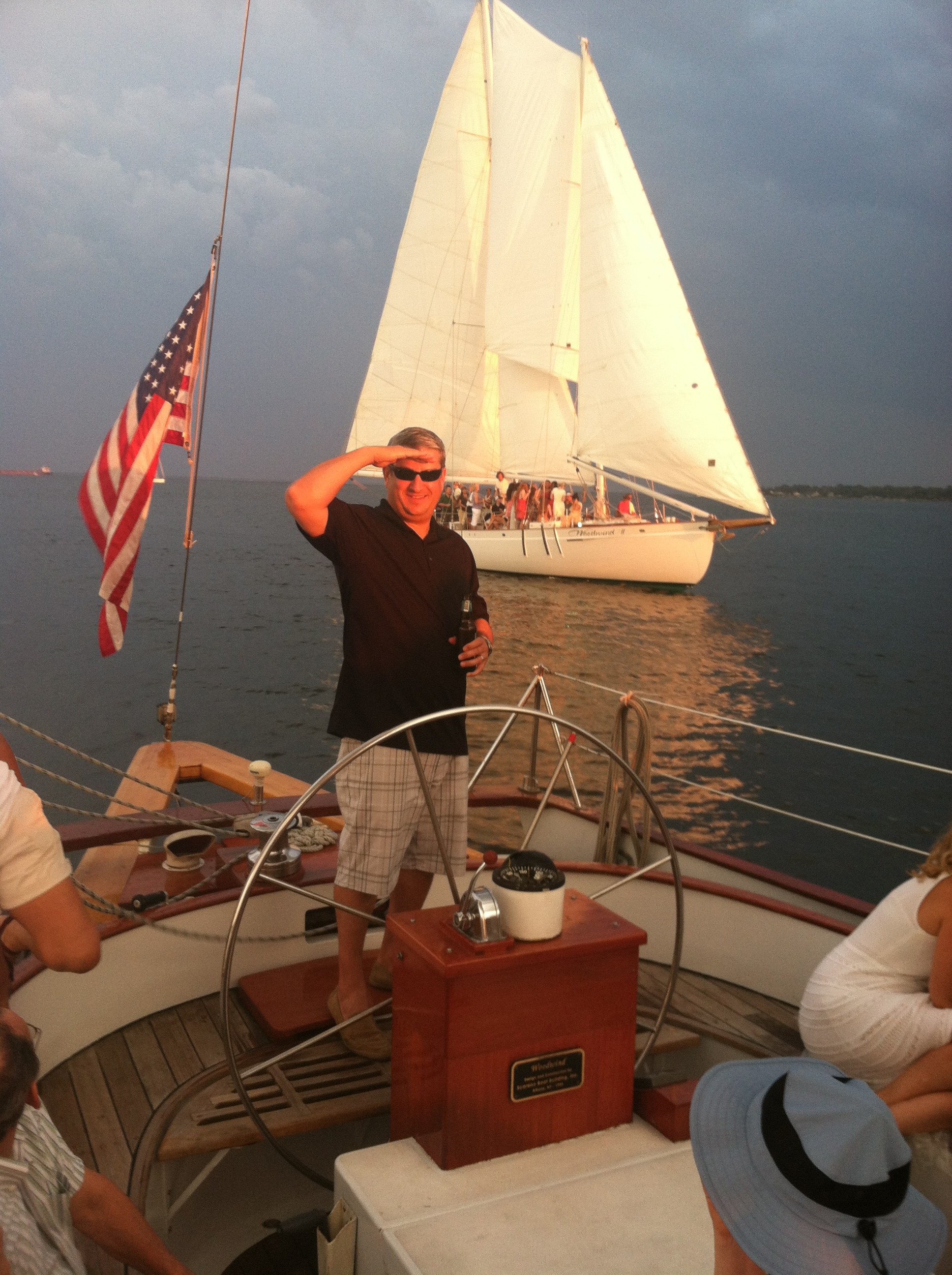 Guest Captain Baker and framed by our sister schooner behind him