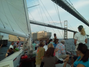 Woodwind sailing under the Chesapeake Bay Bridge while a car carrier crosses under too!
