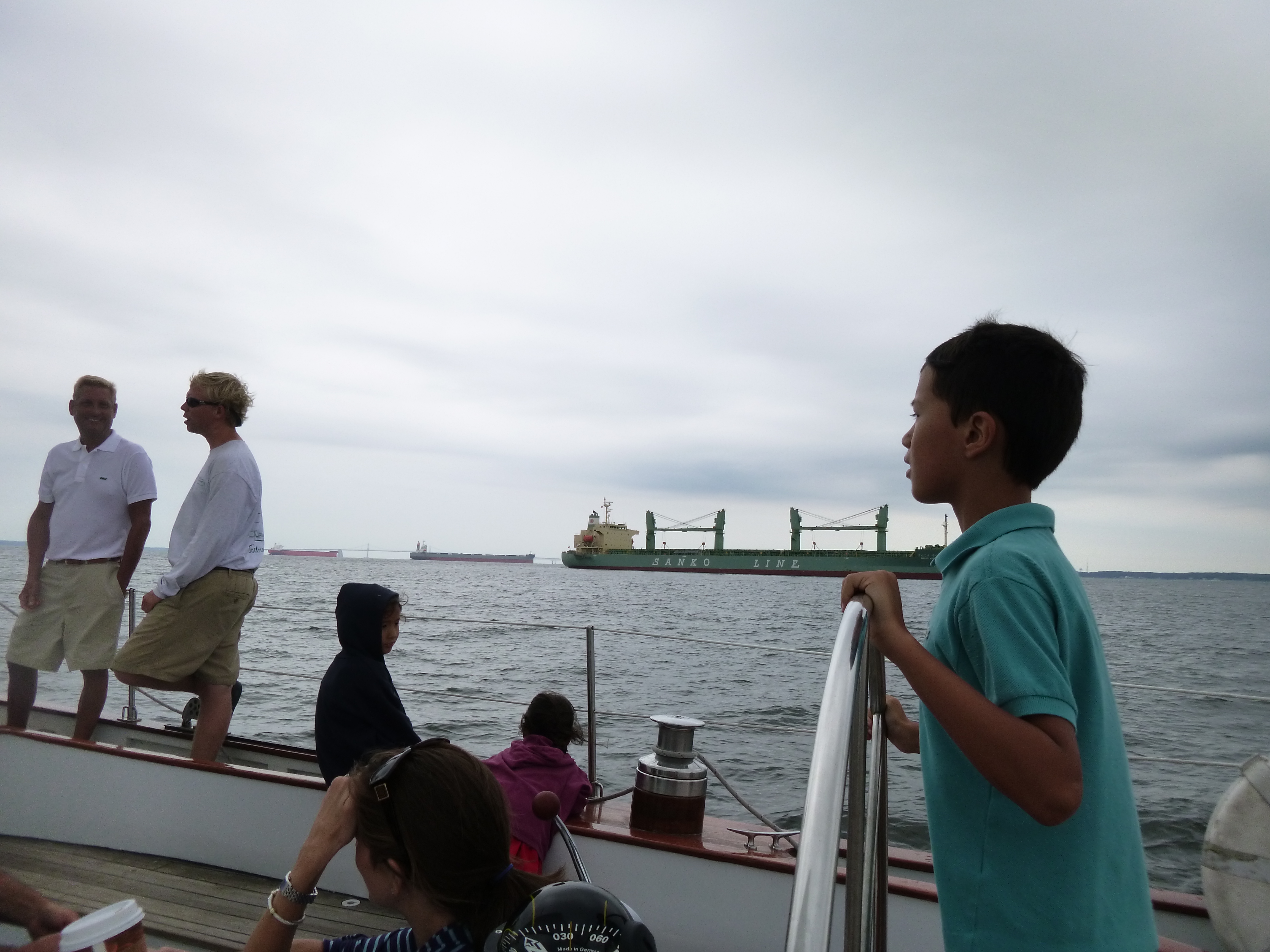 Sailing by an anchored cargo ship on the Chesapeake Bay.