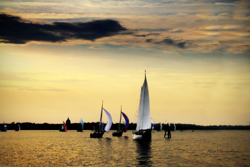 Sailing home through all of the sailboats at sunset