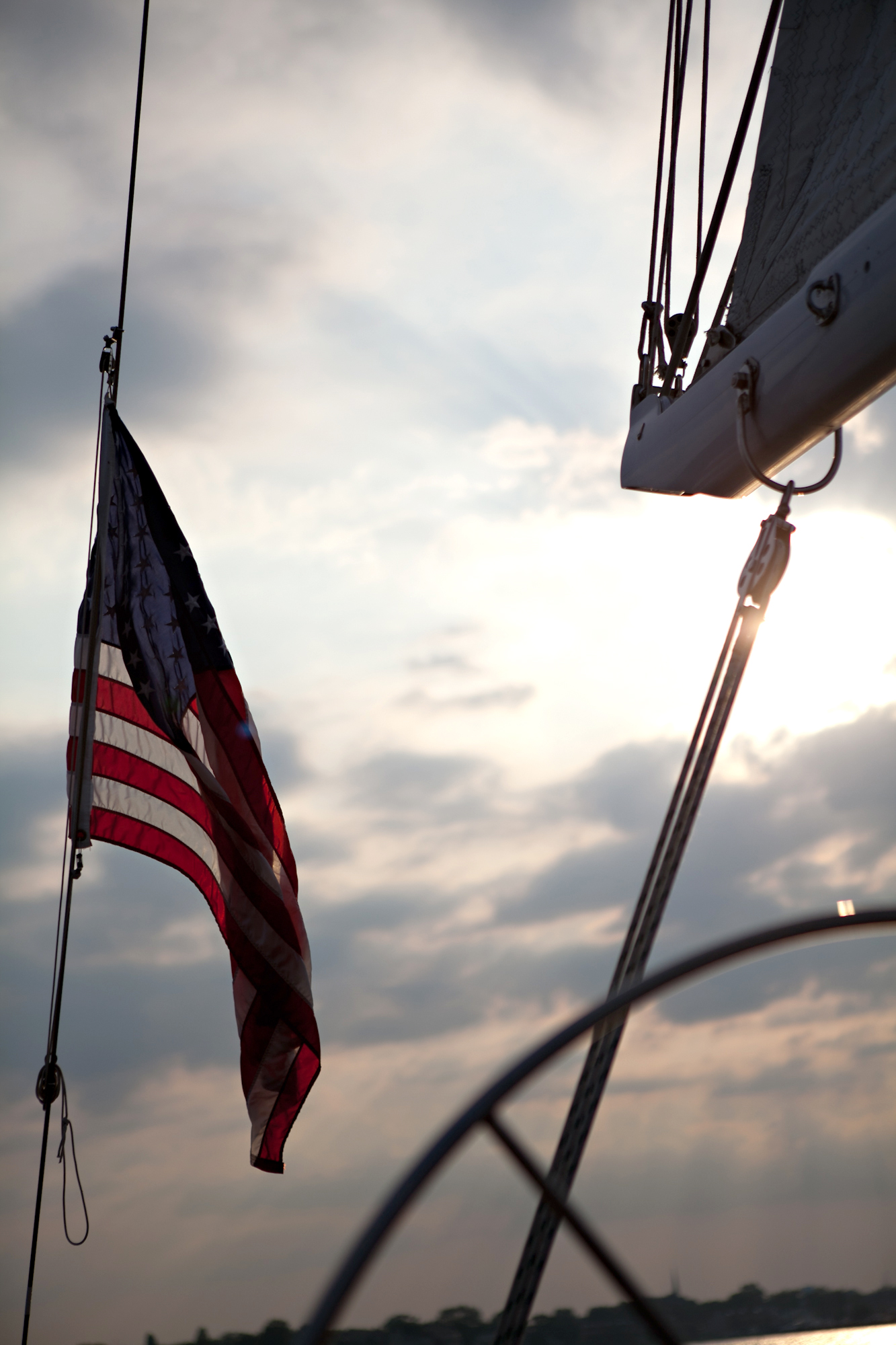 American Flag at the helm of the schooner in the clouds