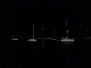 Moon rising above anchored fleet for Annapolis fireworks