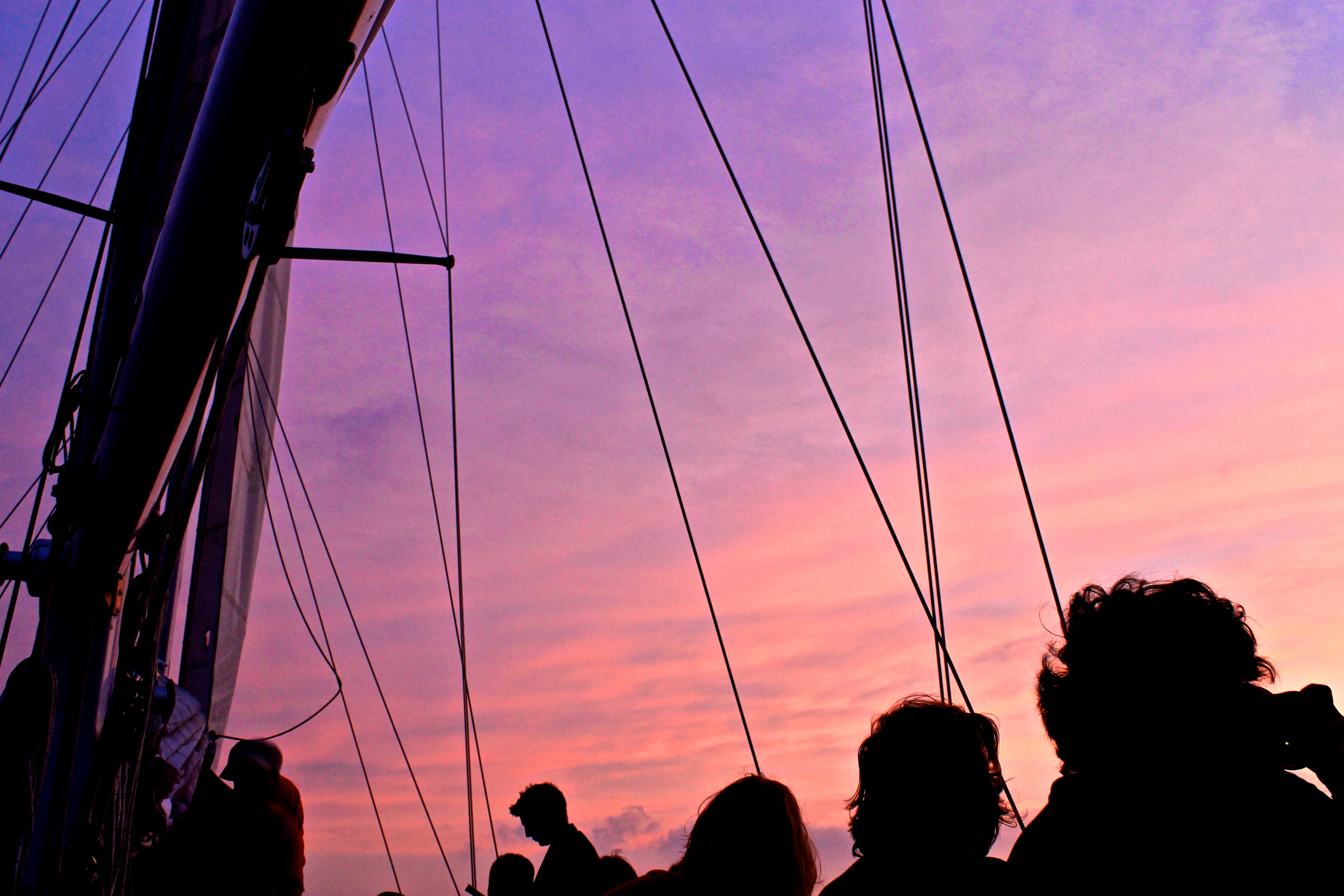 Purple sunset sky above the sails