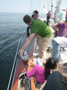 Fisherman trim team adjusting sails on Schooner Woodwind