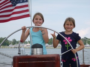 Alyssa and Natalie at the helm of Schooner Woodwind