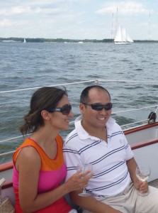 Couple drinking wine on Schooner Woodwind wine tasting cruise