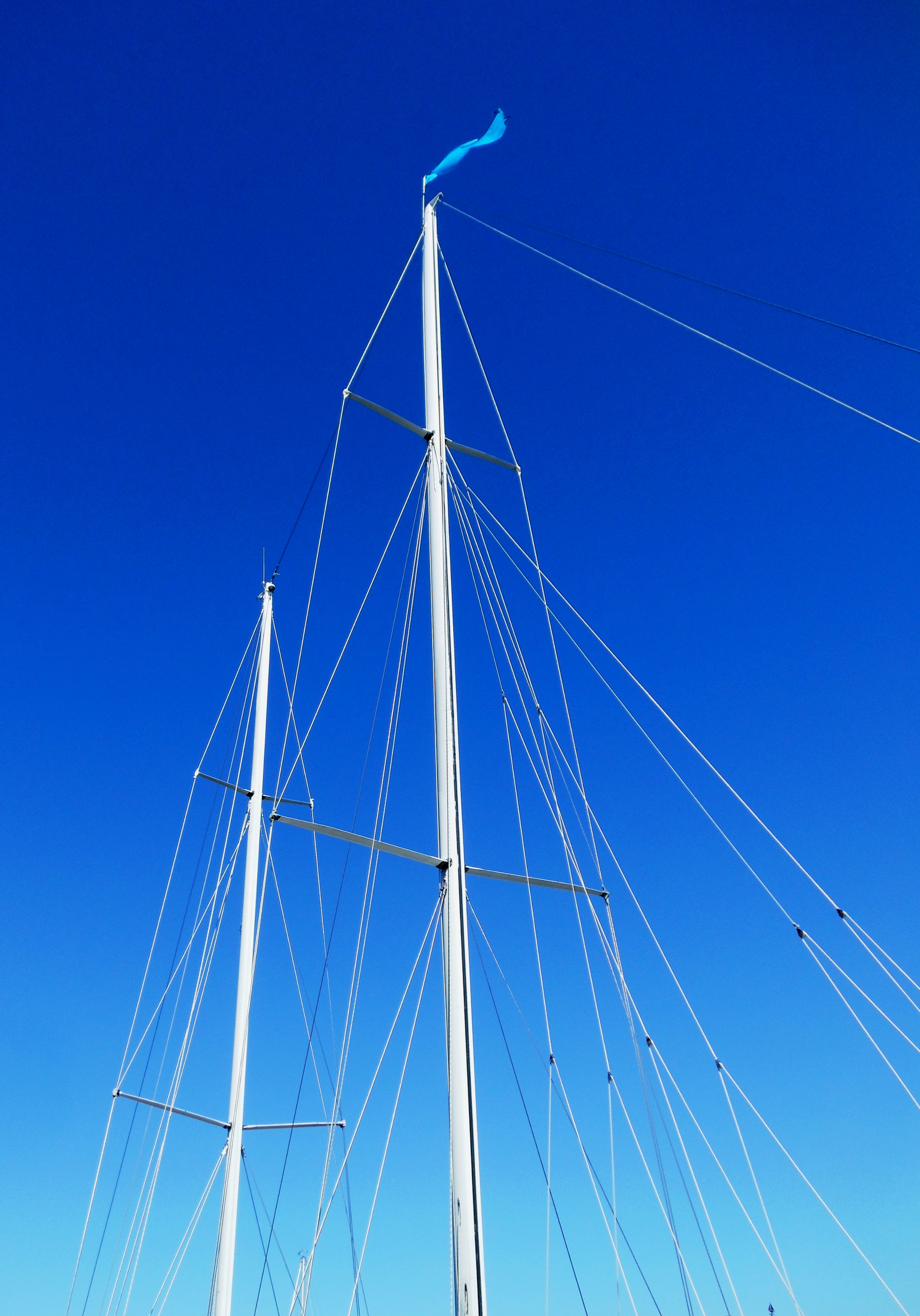 Masts and rigging against brilliant blue sky