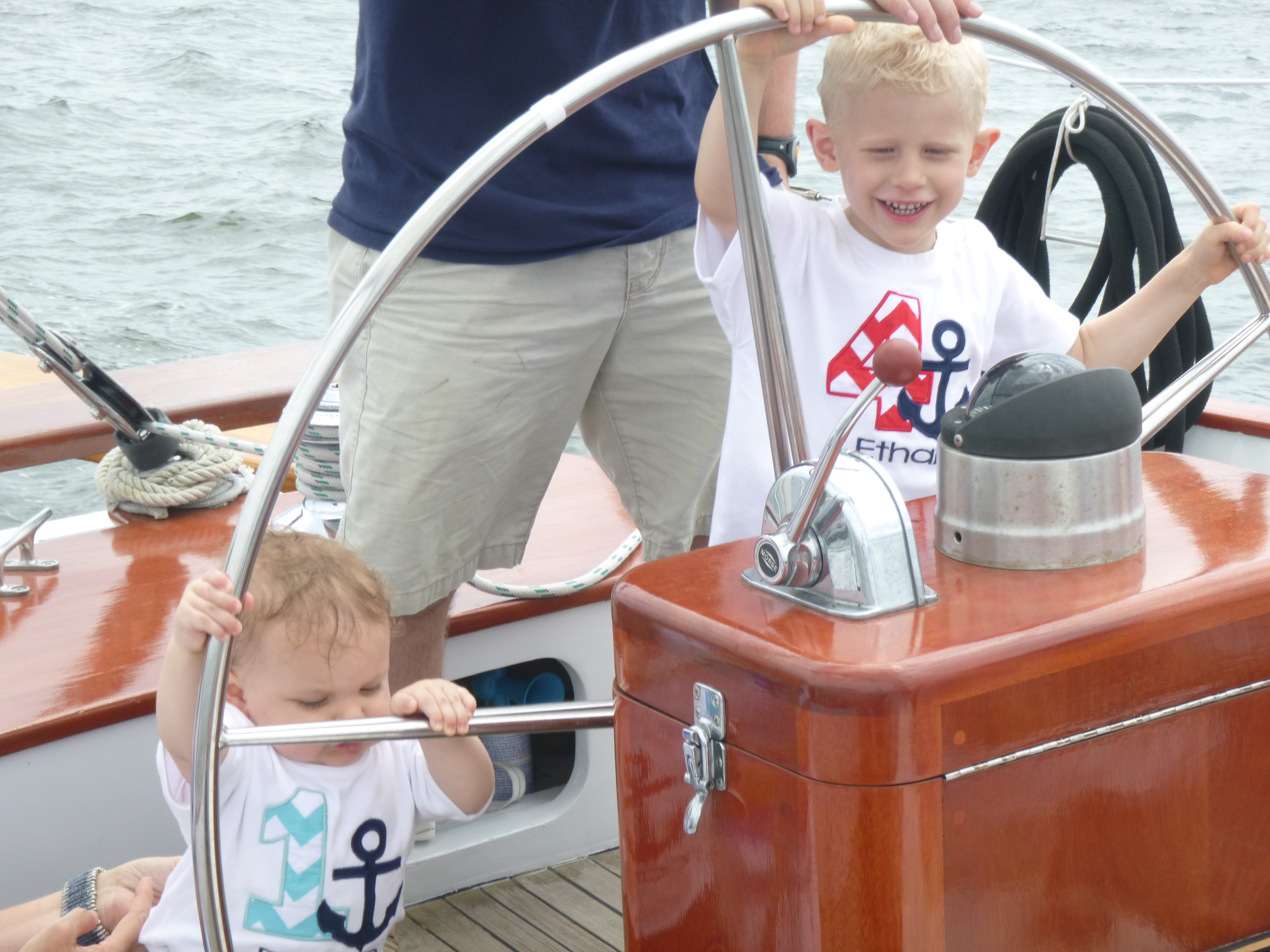 Two very young guests helping to steer the schooner