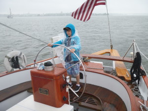 Ethan at the wheel of Woodwind II