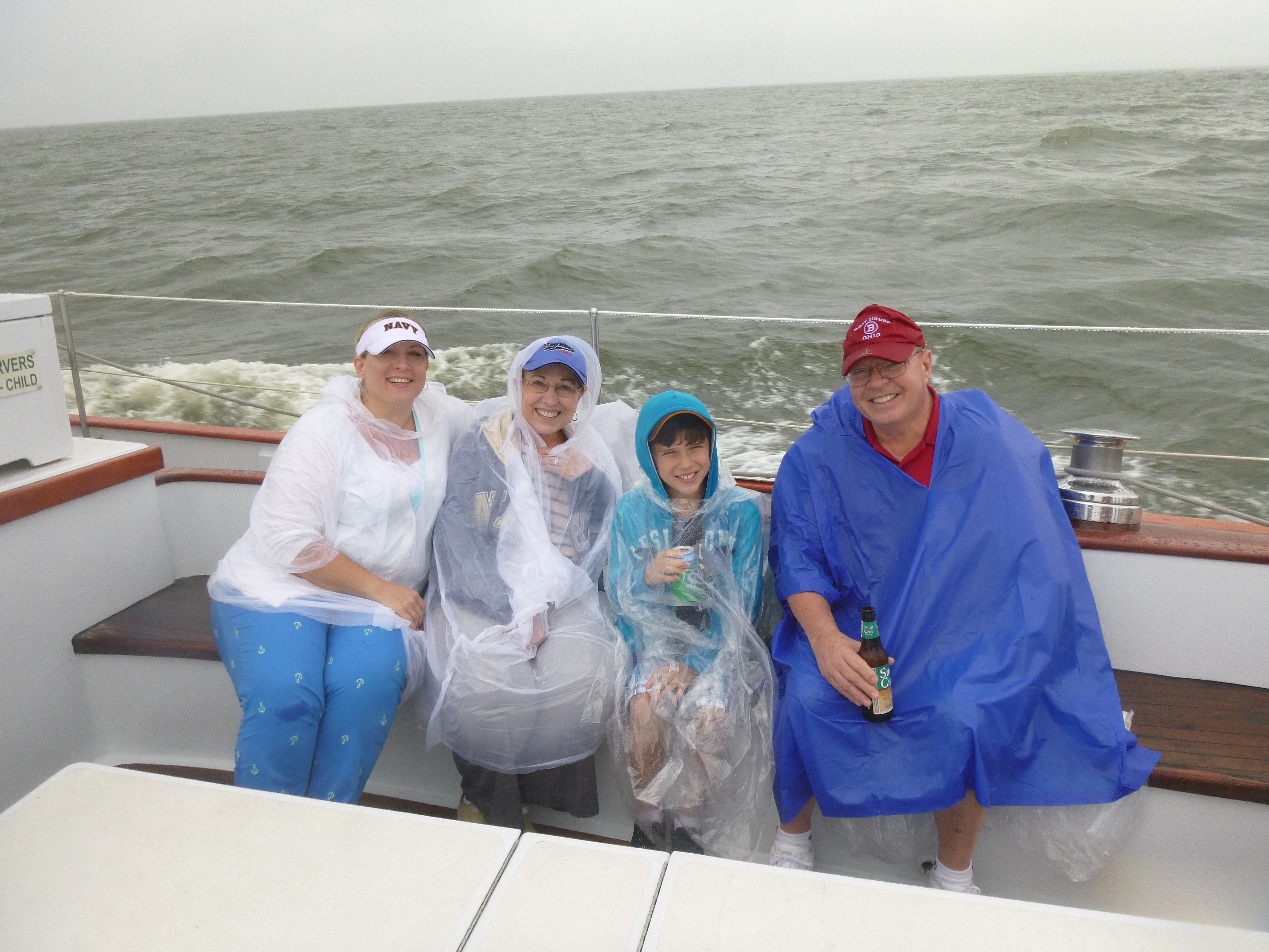 The Renninger Family in ponchos on a rainy day