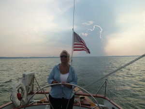 At the helm of the Woodwind! Check out the cool cloud behind her too!