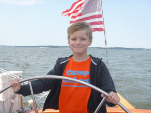 Dillon at the wheel of the 74' schooner Woodwind