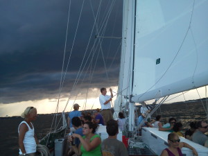 Storm clouds with the golden glow of sun on the other side of the storms.