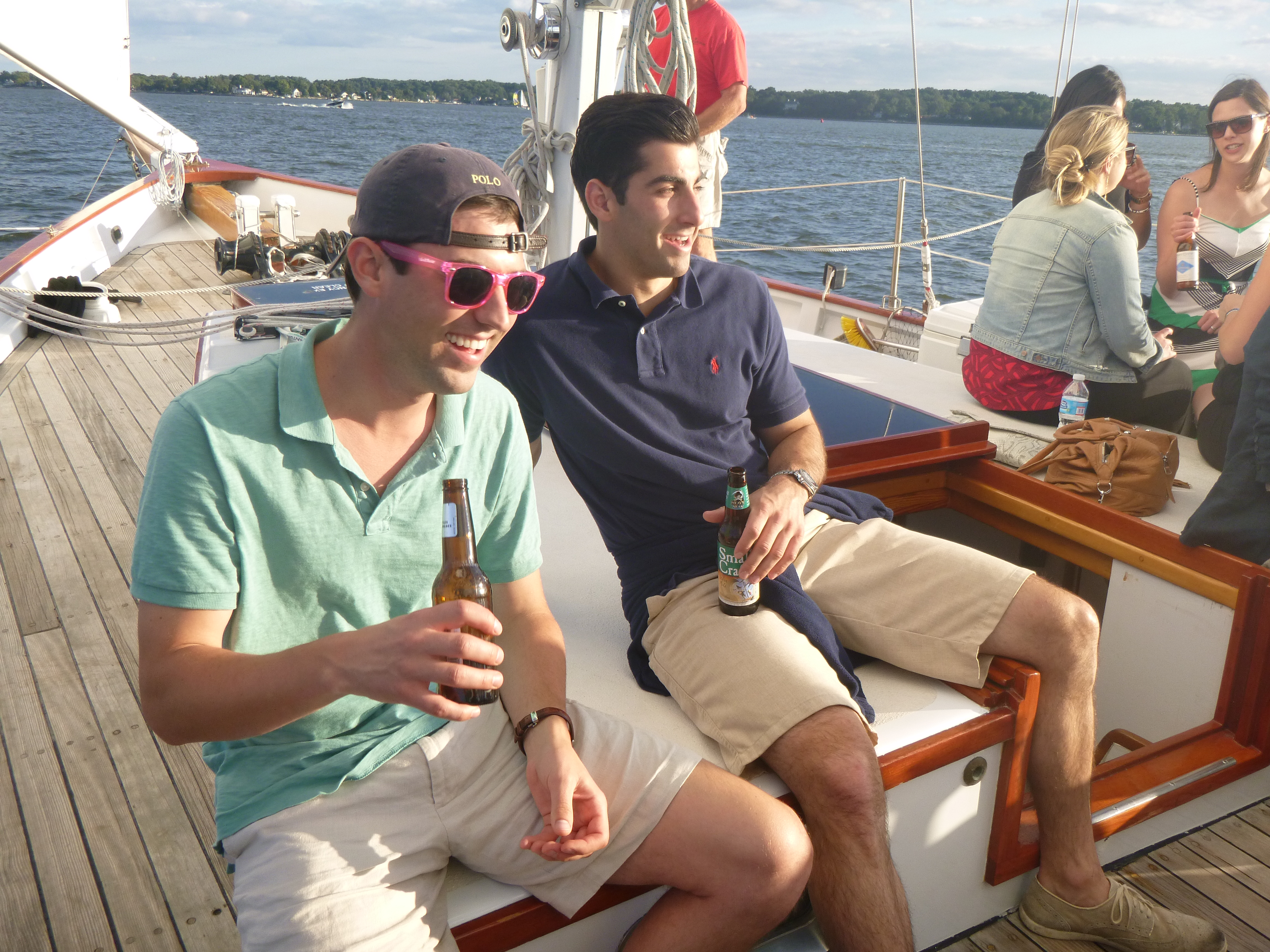 Two gentlemen enjoying beverages and a sunny sail