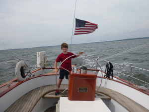 Joe at the wheel of the Schooner Woodwind