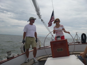 Mary at the wheel of the Schooner Woodwind II