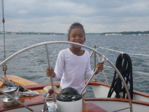 All smiles.. showing Capt. Mickey the proper way to steer the boat