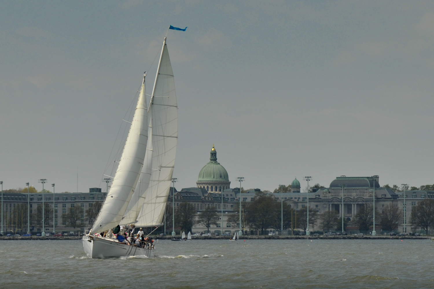 Schooner under sail with USNA Chapel Dome in back ground