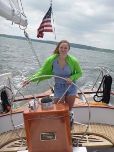 Zoe at the helm of the Schooner Woodwind II