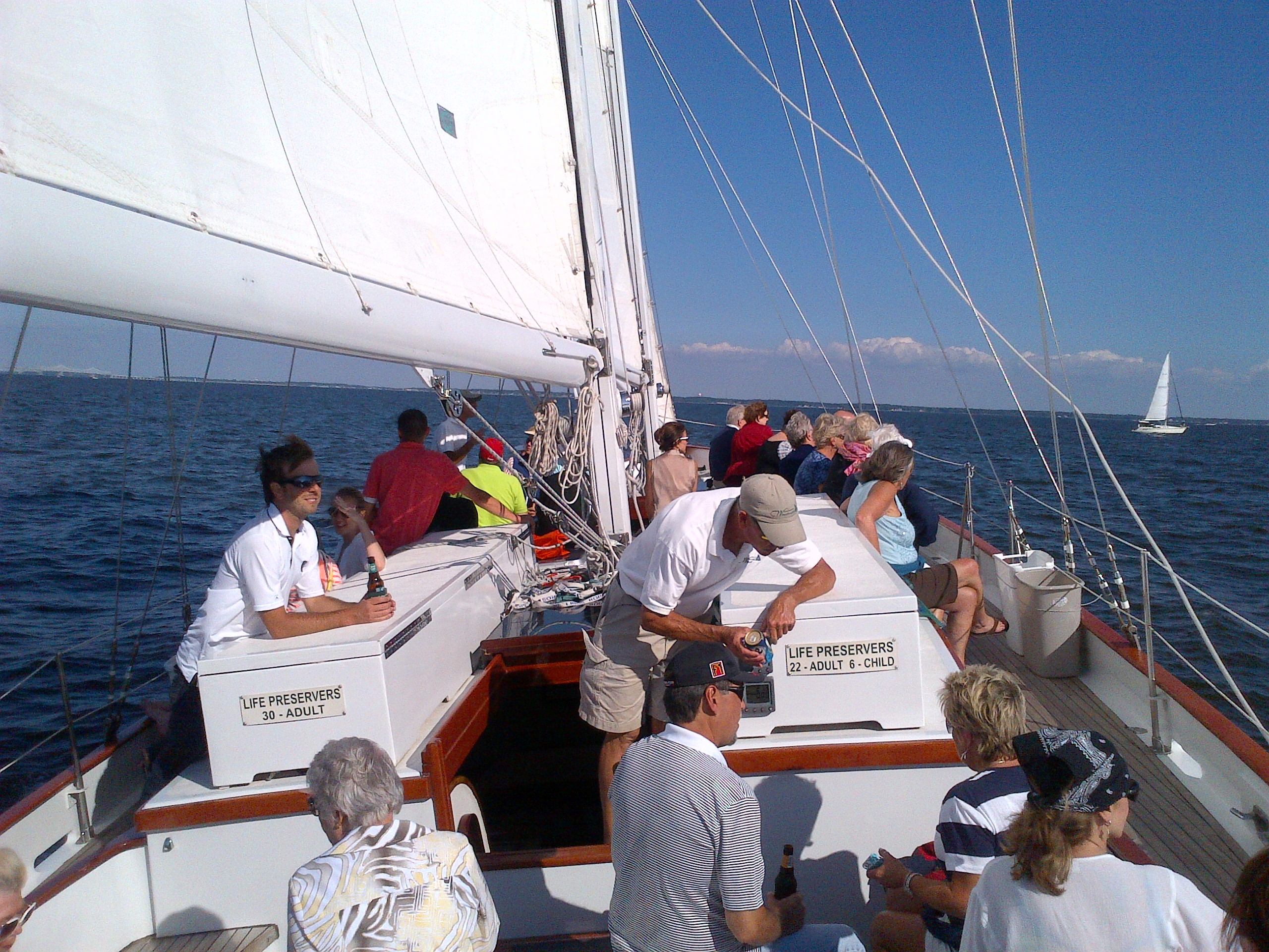 Guests enjoying a breezy sunny sail on the schooner
