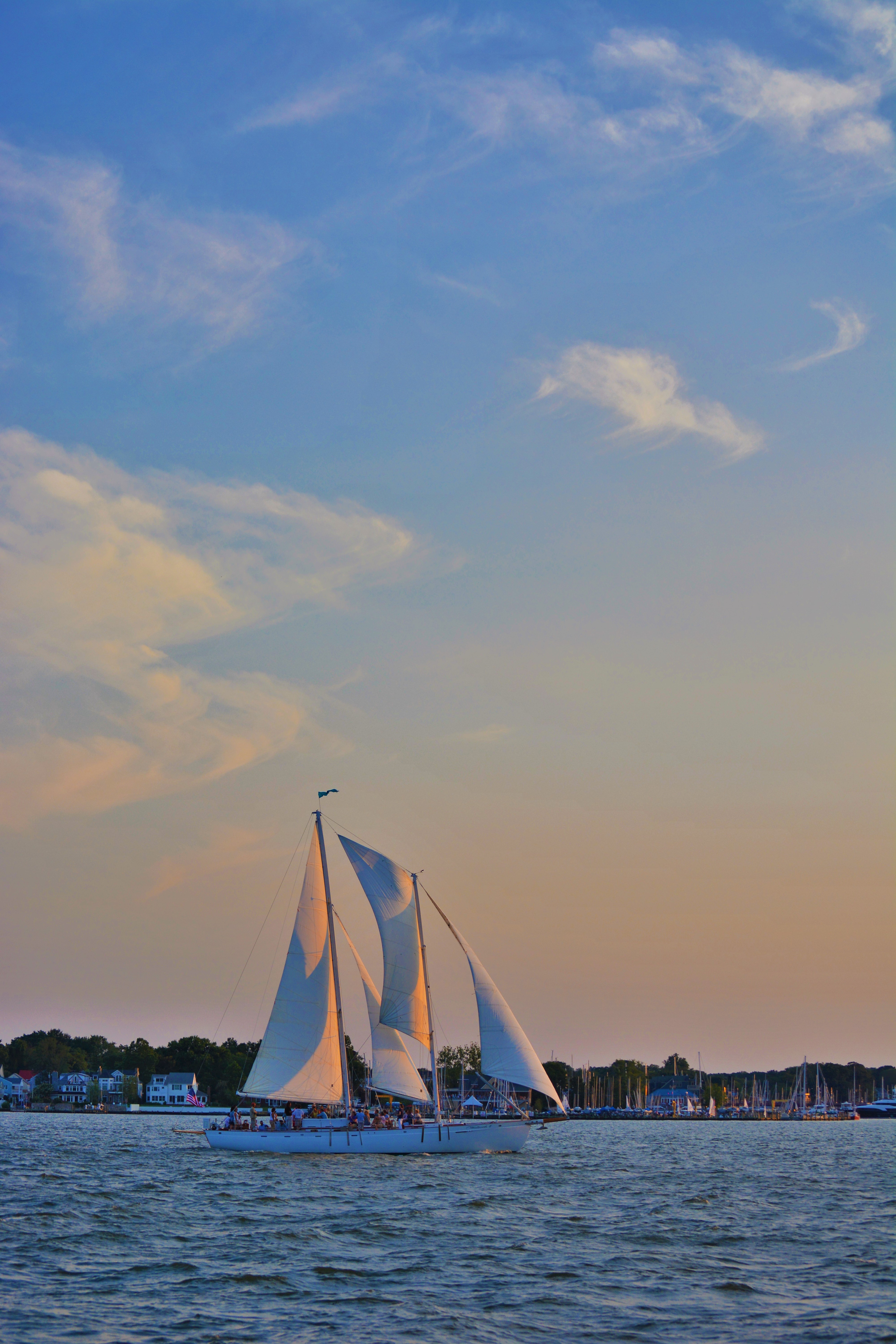 Blue pastel colors framing the schooner at sunset