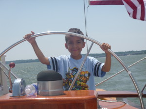 Jason at the Wheel of the Schooner Woodwind