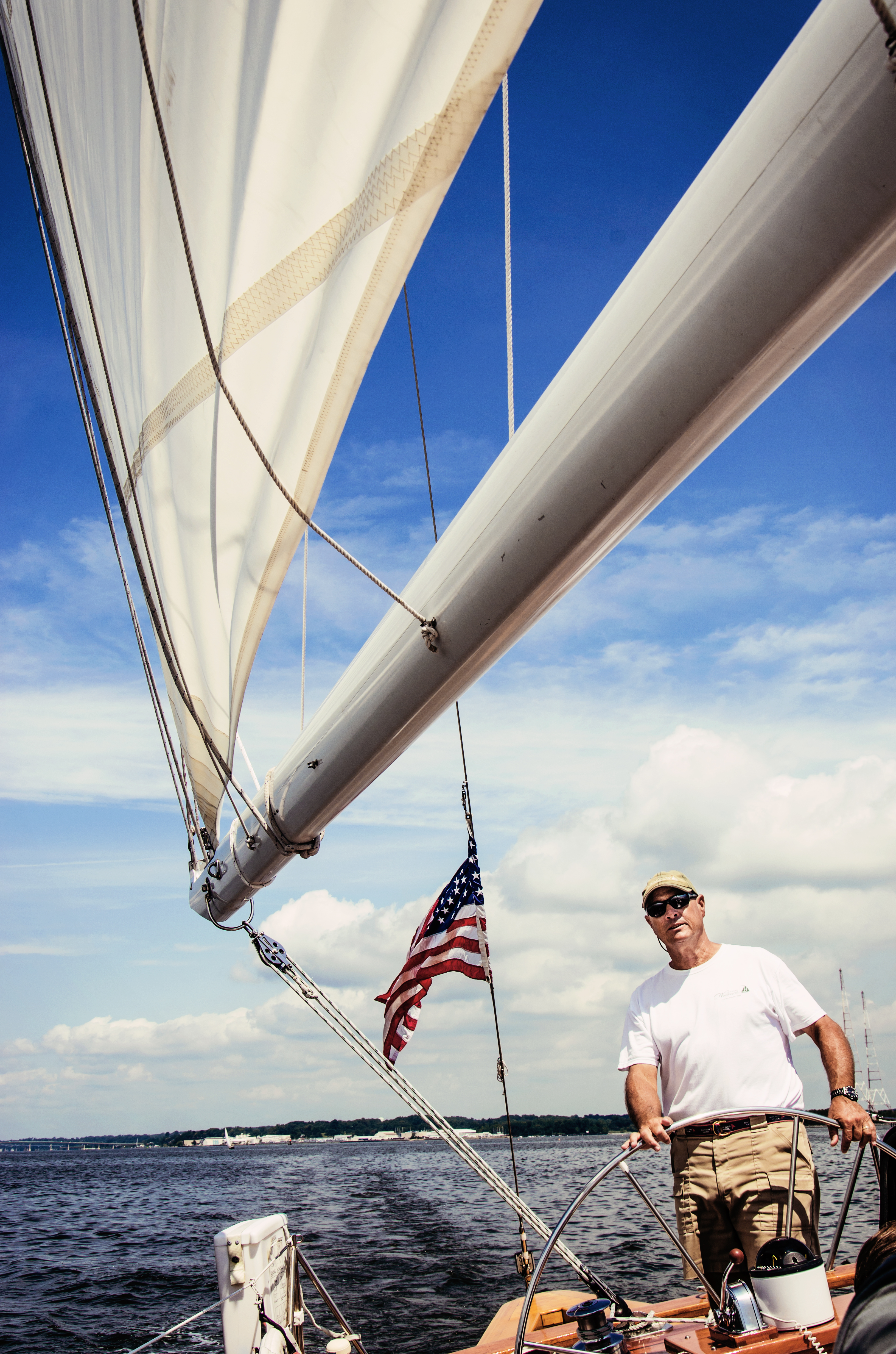 Blue skies and fair sails with the captain at the helm