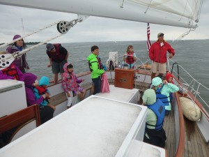 At the wheel of the Schooner Woodwind