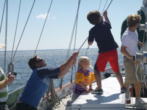 Wyatt and Caroline helping dad with the stay sail