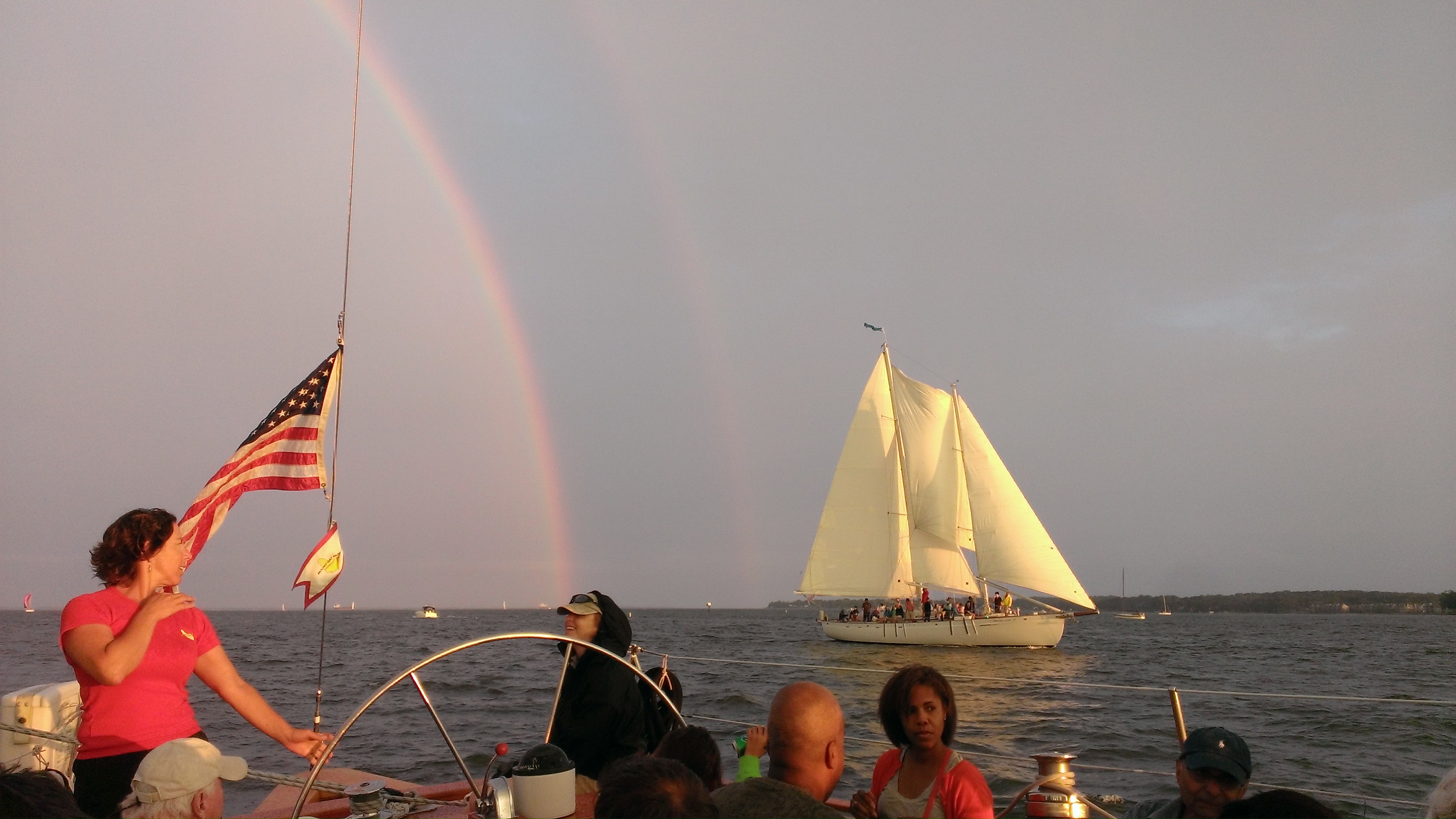 Rainbow over both schooners sailing together