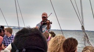 Om plays a popular tune that might have been played as the ship "Peggy Stewart" burned to the waterline and then sank.