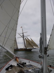 Pride of Baltimore setting her sails off the bow of Woodwind II