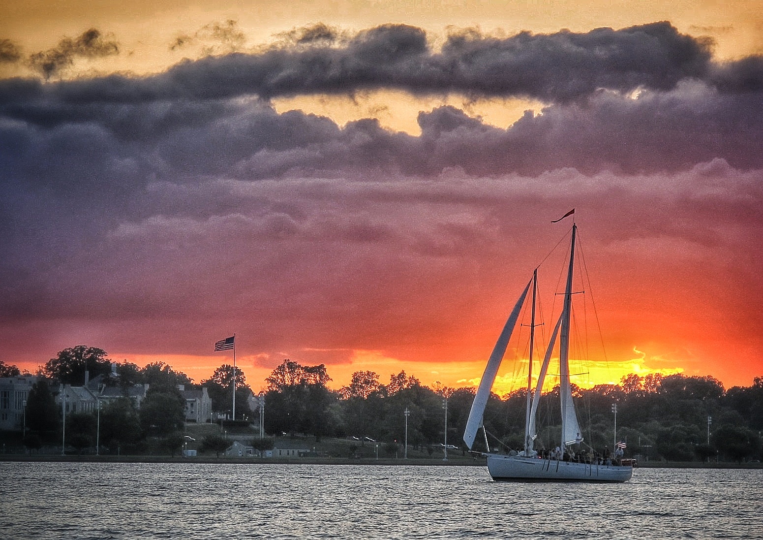Picture of the schooner in all grey except the sunset in brilliant Orange