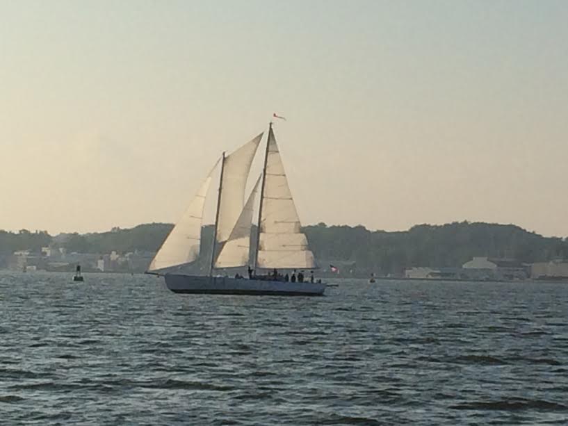 Schooner on a blue horizon in full sail