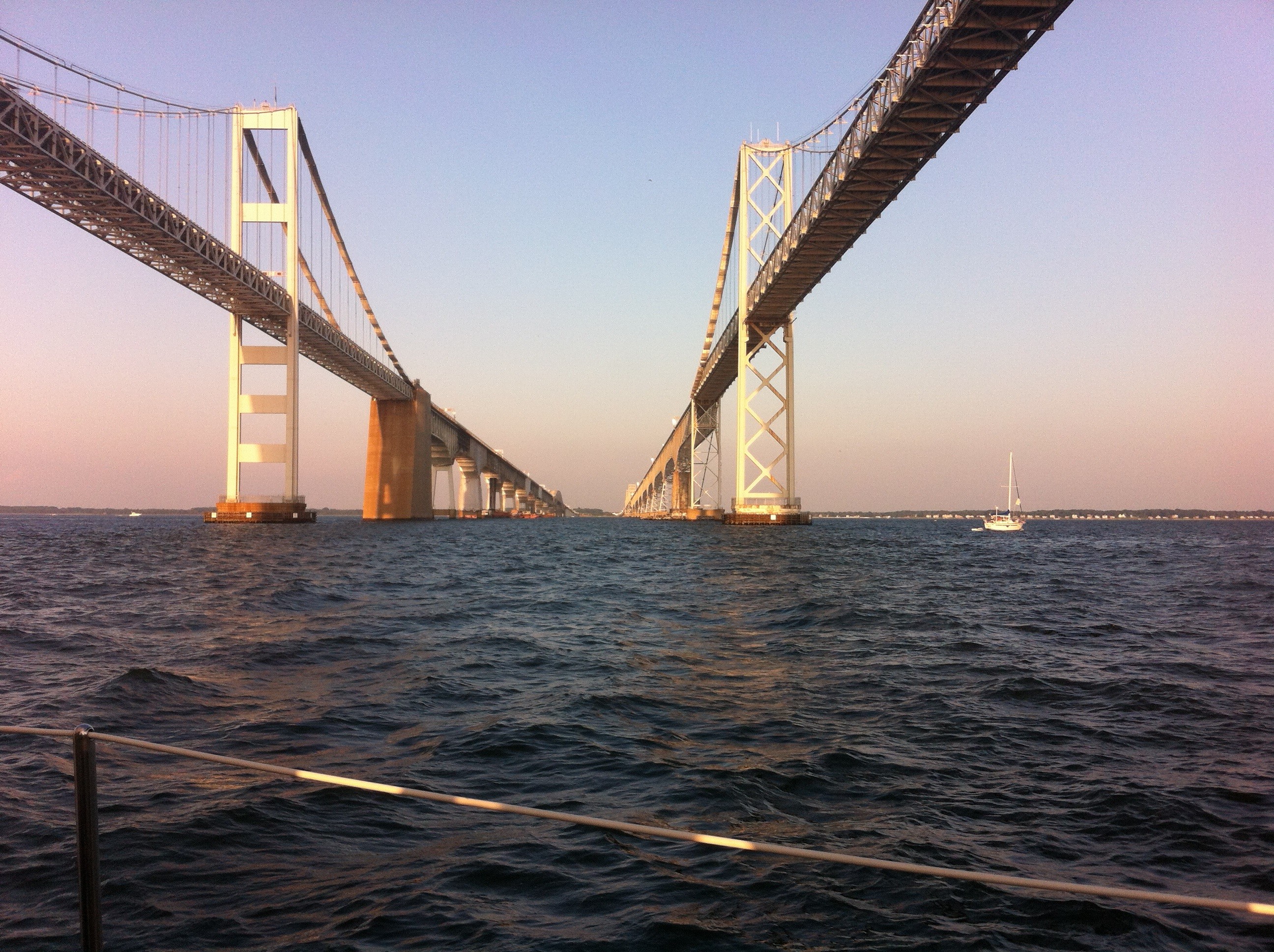 Beautiful shot of both sides of the Bay Bridge as the schooner sails under