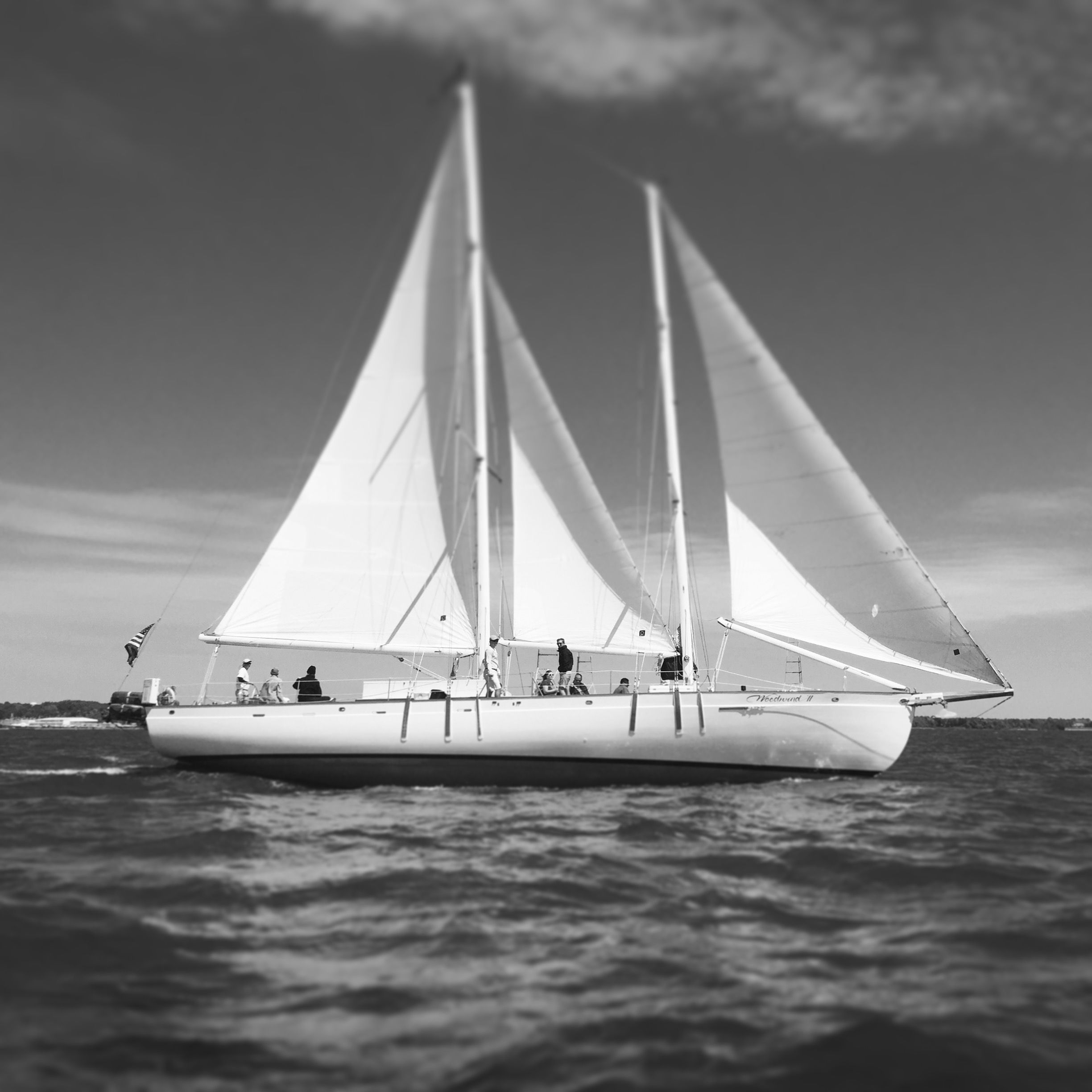 Schooner in a black and white photograph under full sail