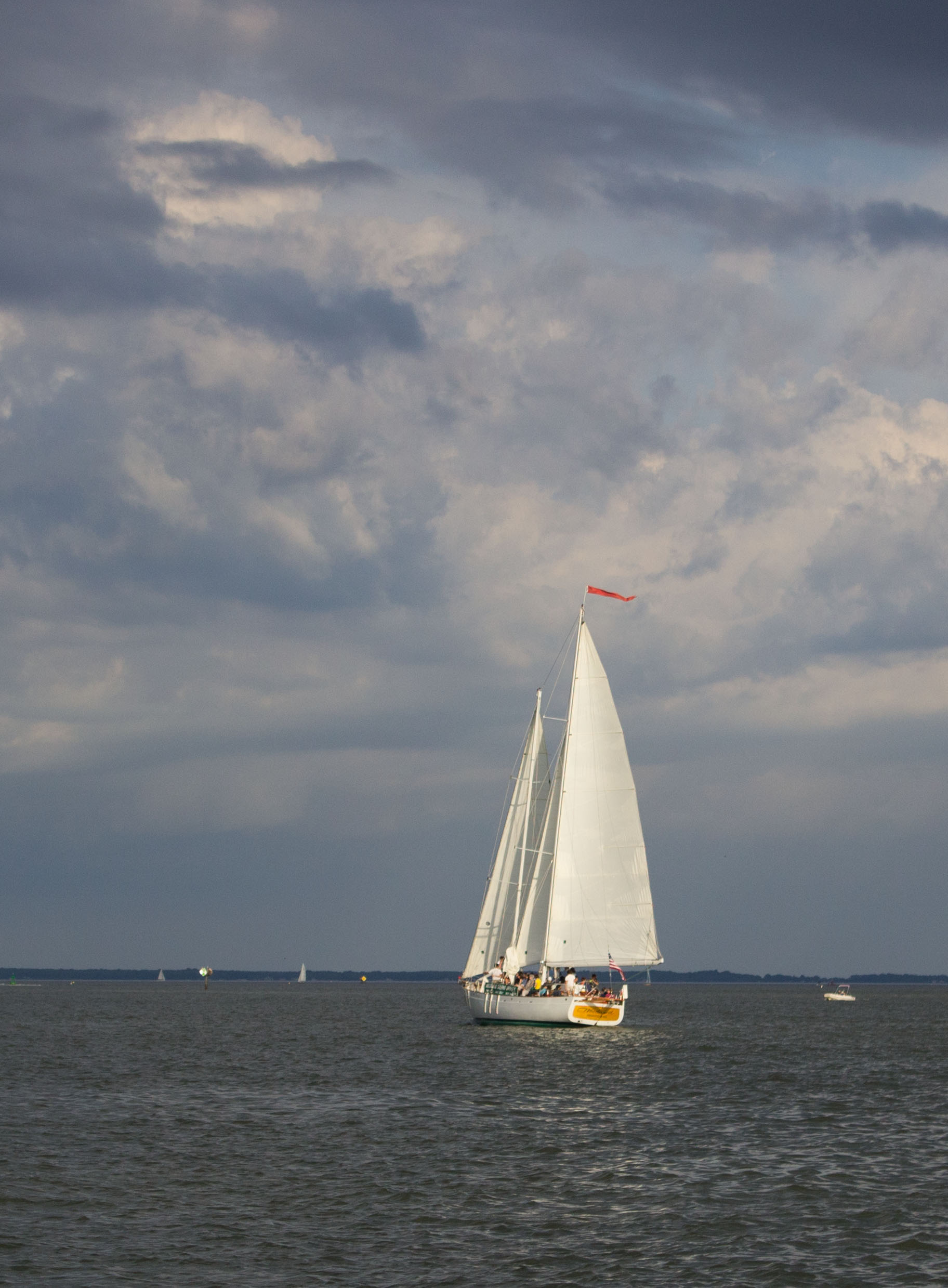Full shot of the schooner under full sail on a cloudy day