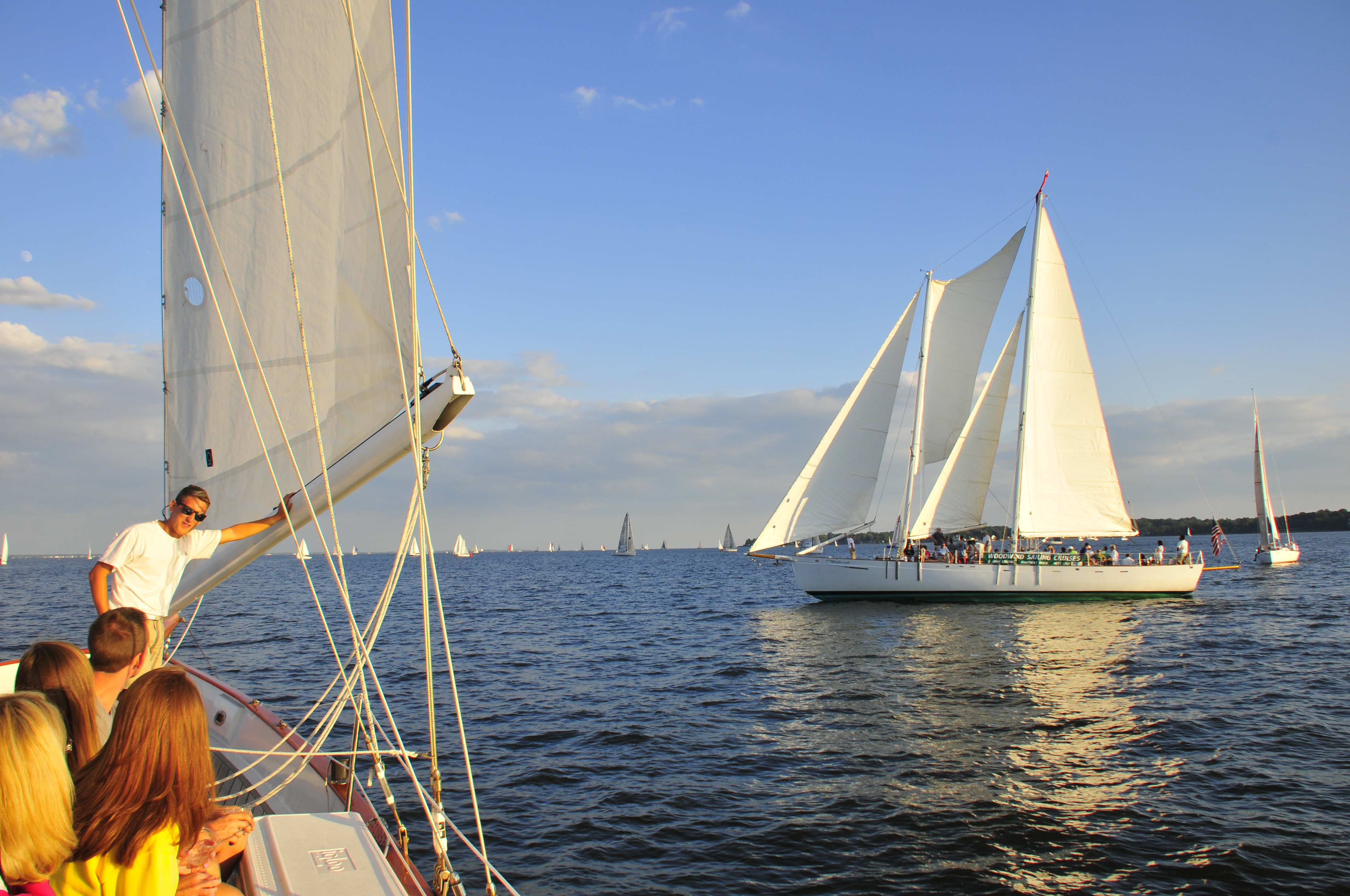 Picture from one schooner to another sailing on a sunny blue day