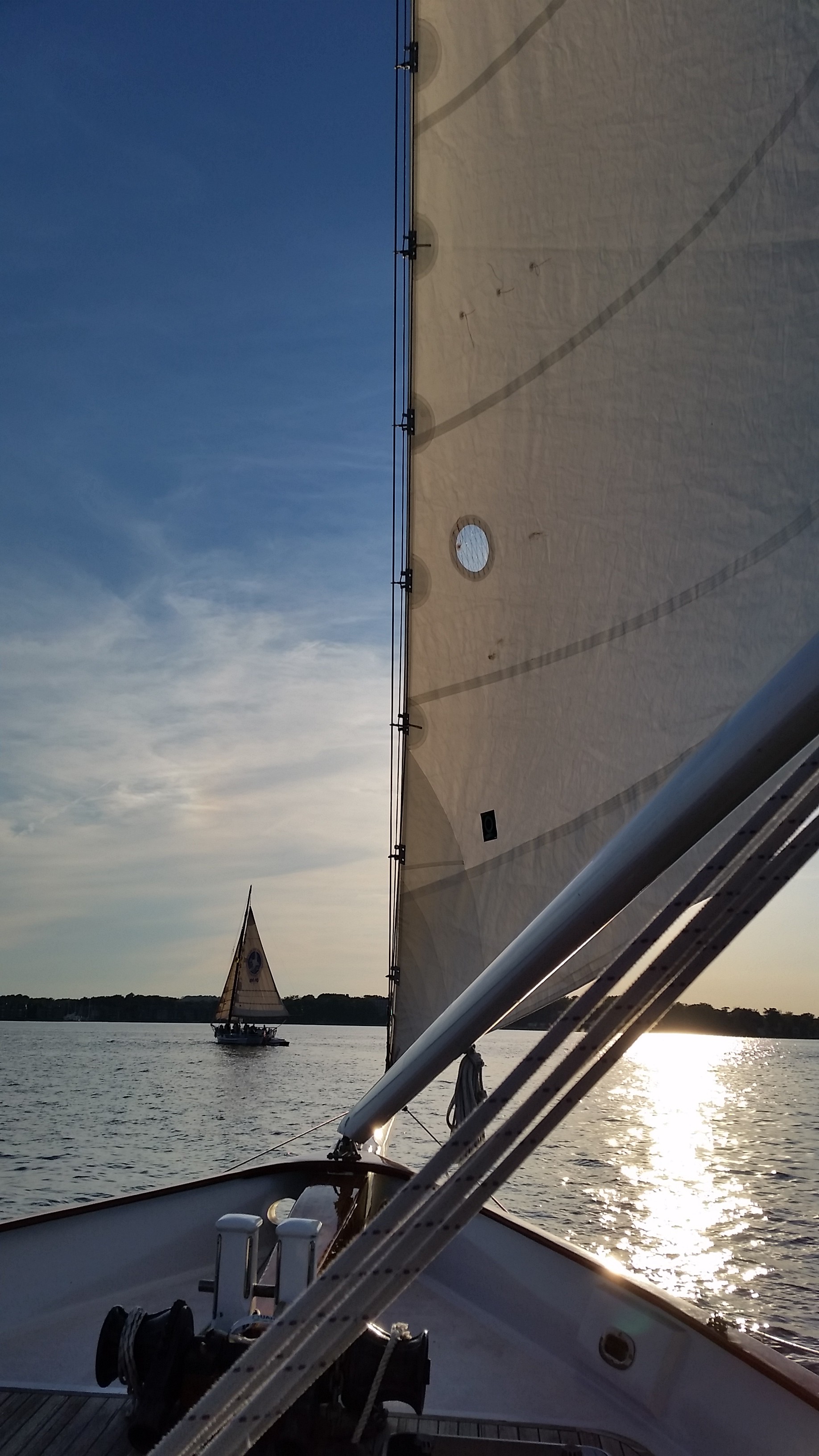 Schooner following schooner on a beautiful sunset evening