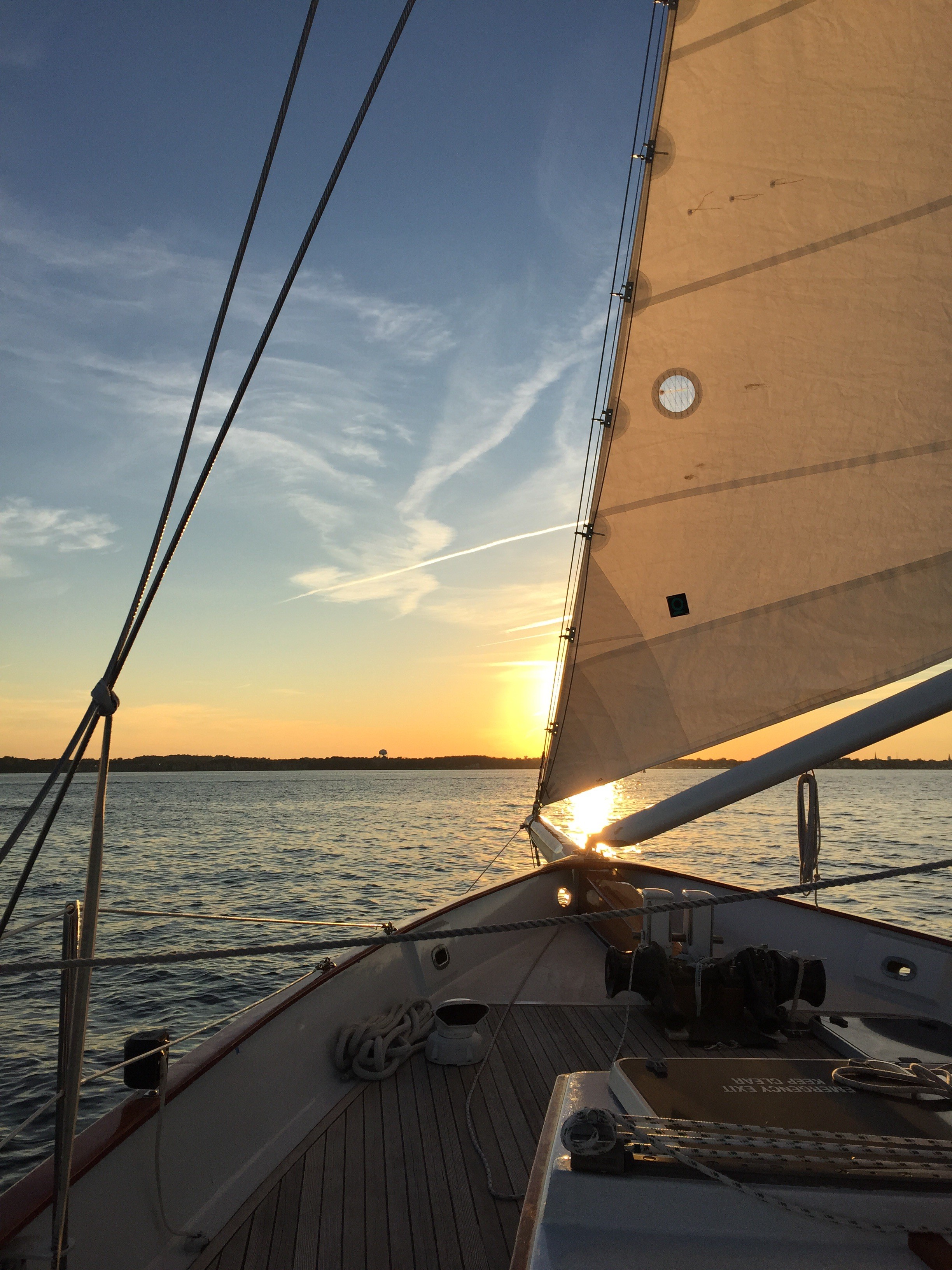 Gentle breeze blowing the sails into a beautiful sunset on the schooner