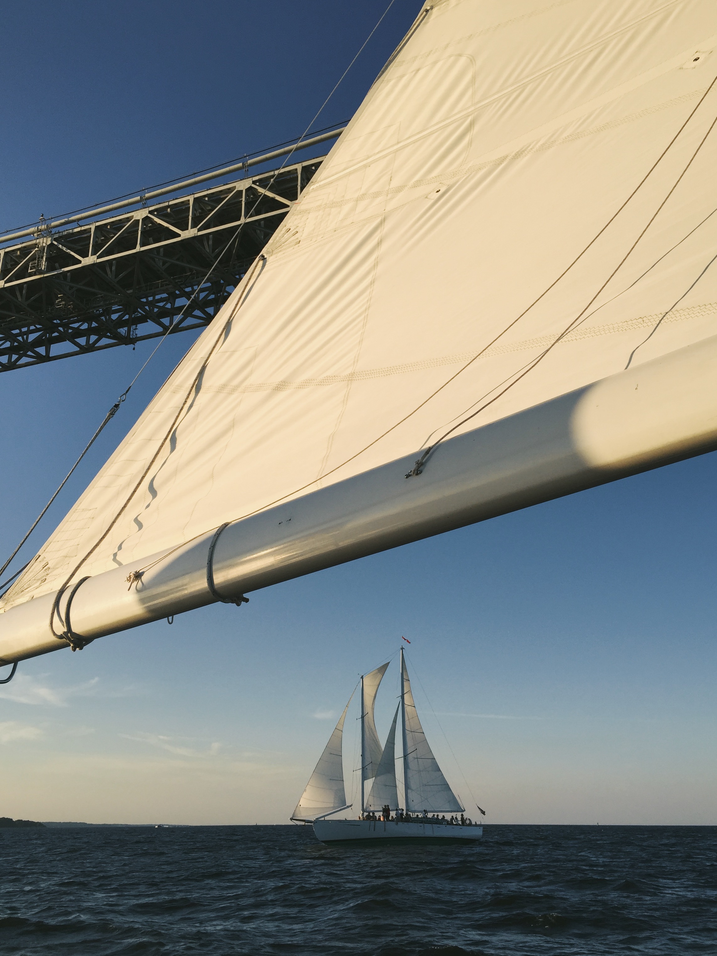 Schooner sailing under the Bay Bridge taken from second schooner