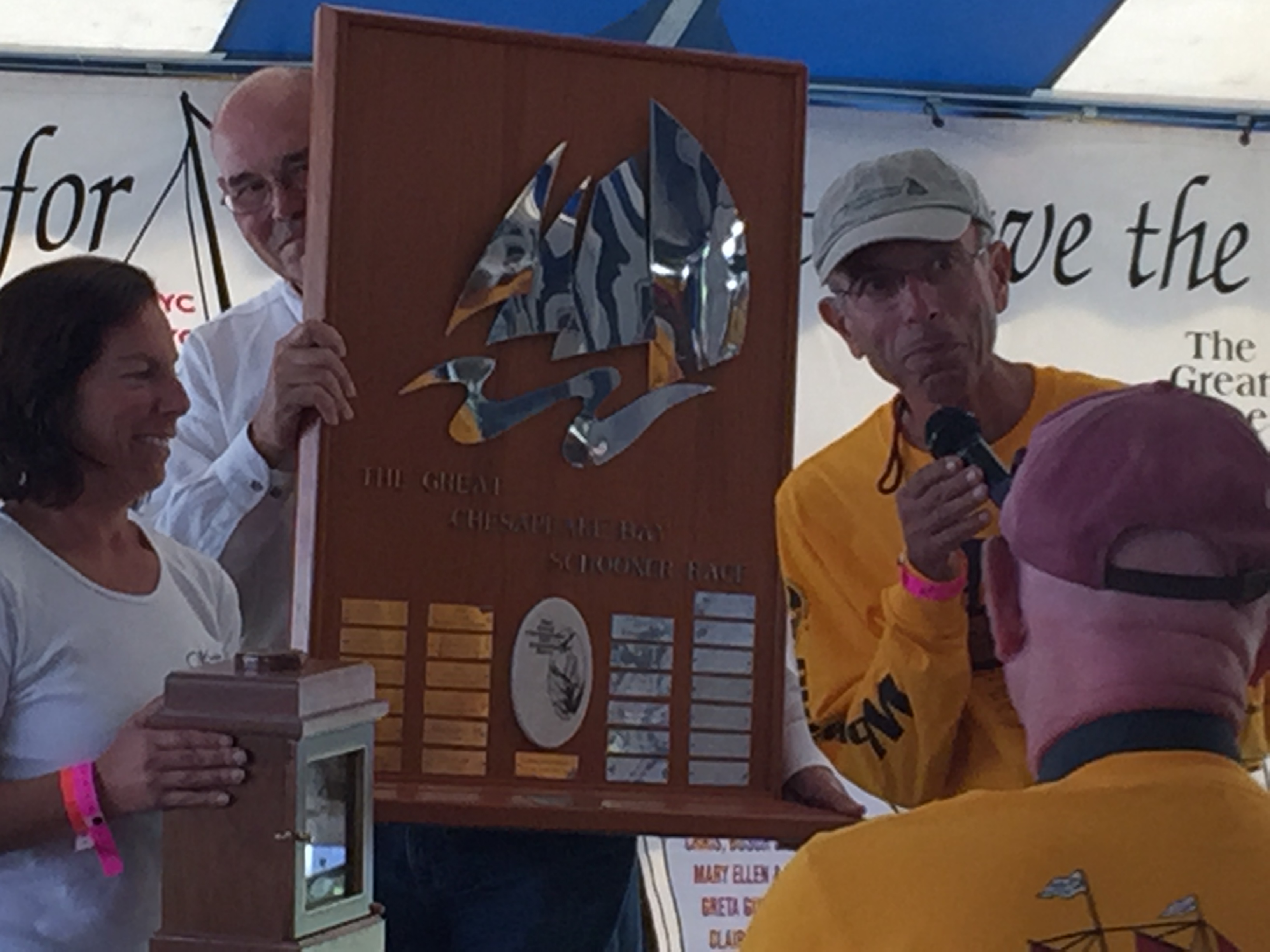 Schooner Woodwind owners being presented trophy for The Great Chesapeake Bay Schooner Race