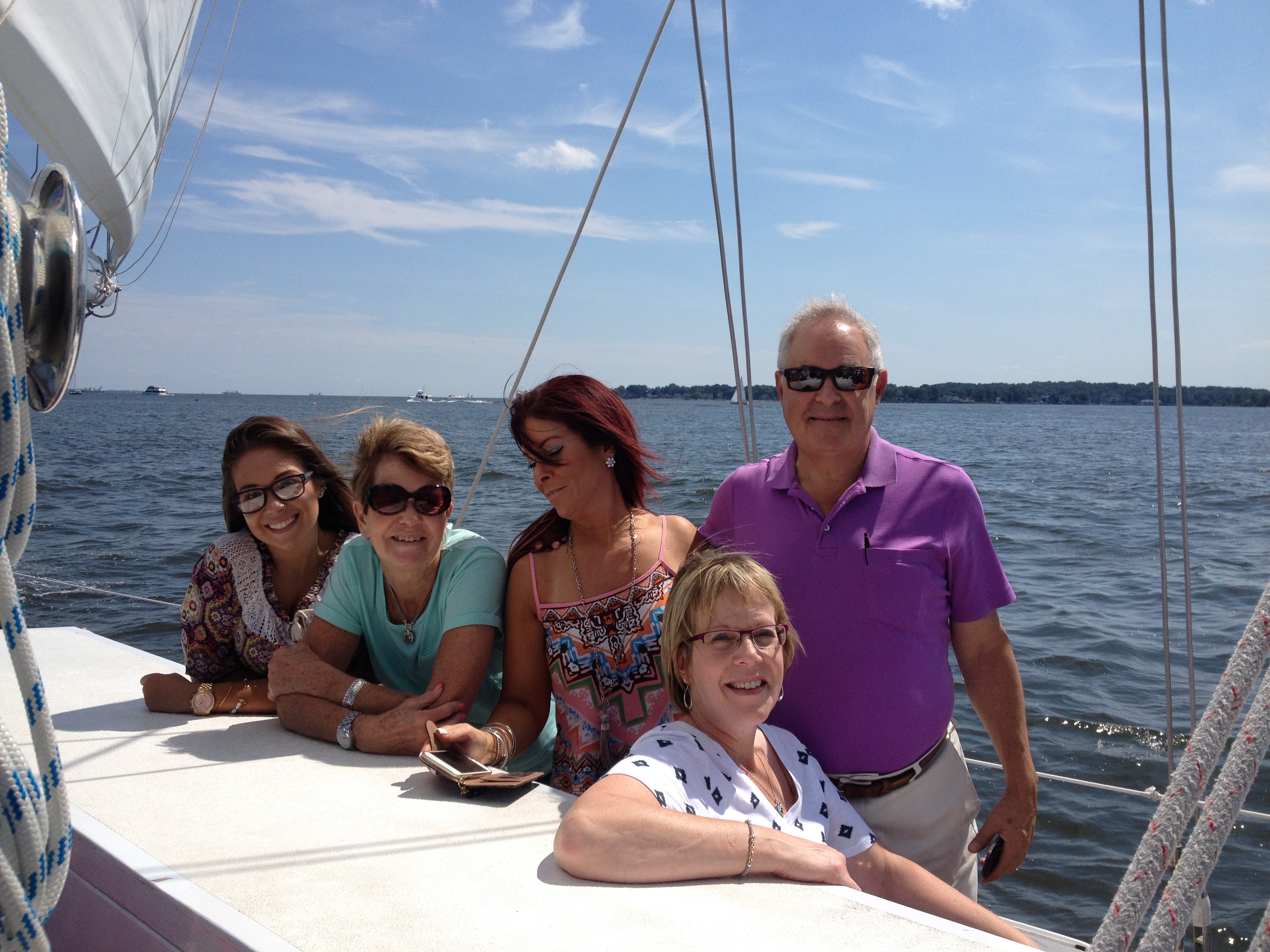 Family of five enjoying a sunny day sail on the Chesapeake Bay