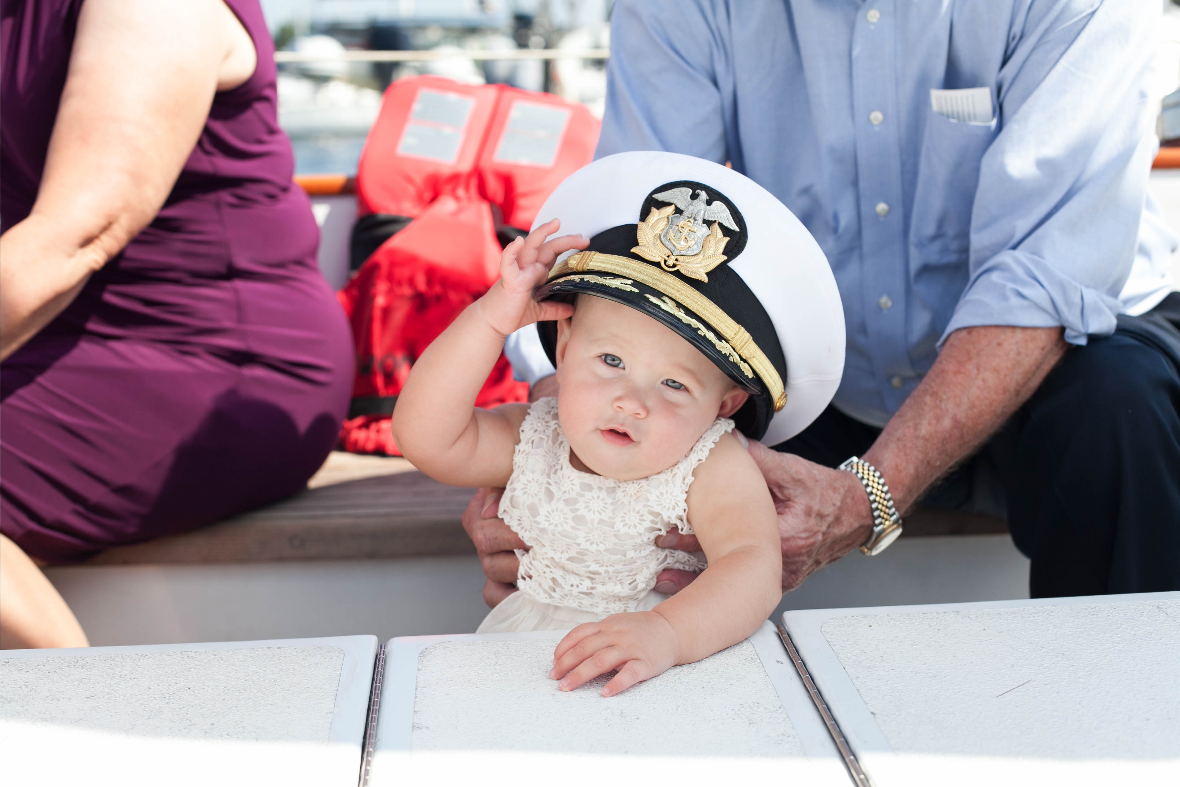 Baby girl that was a flower girl with Captains lid on