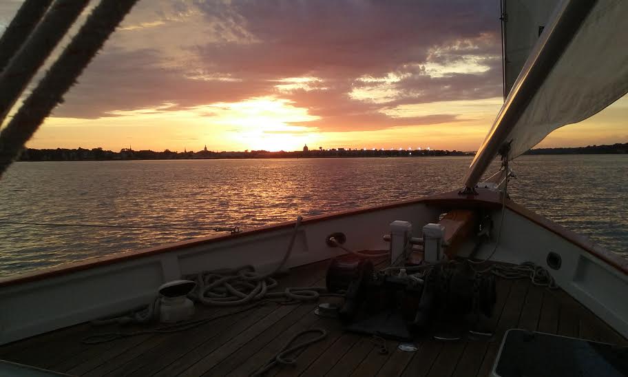Sunset over Annapolis viewed from the bow of schooner under sail