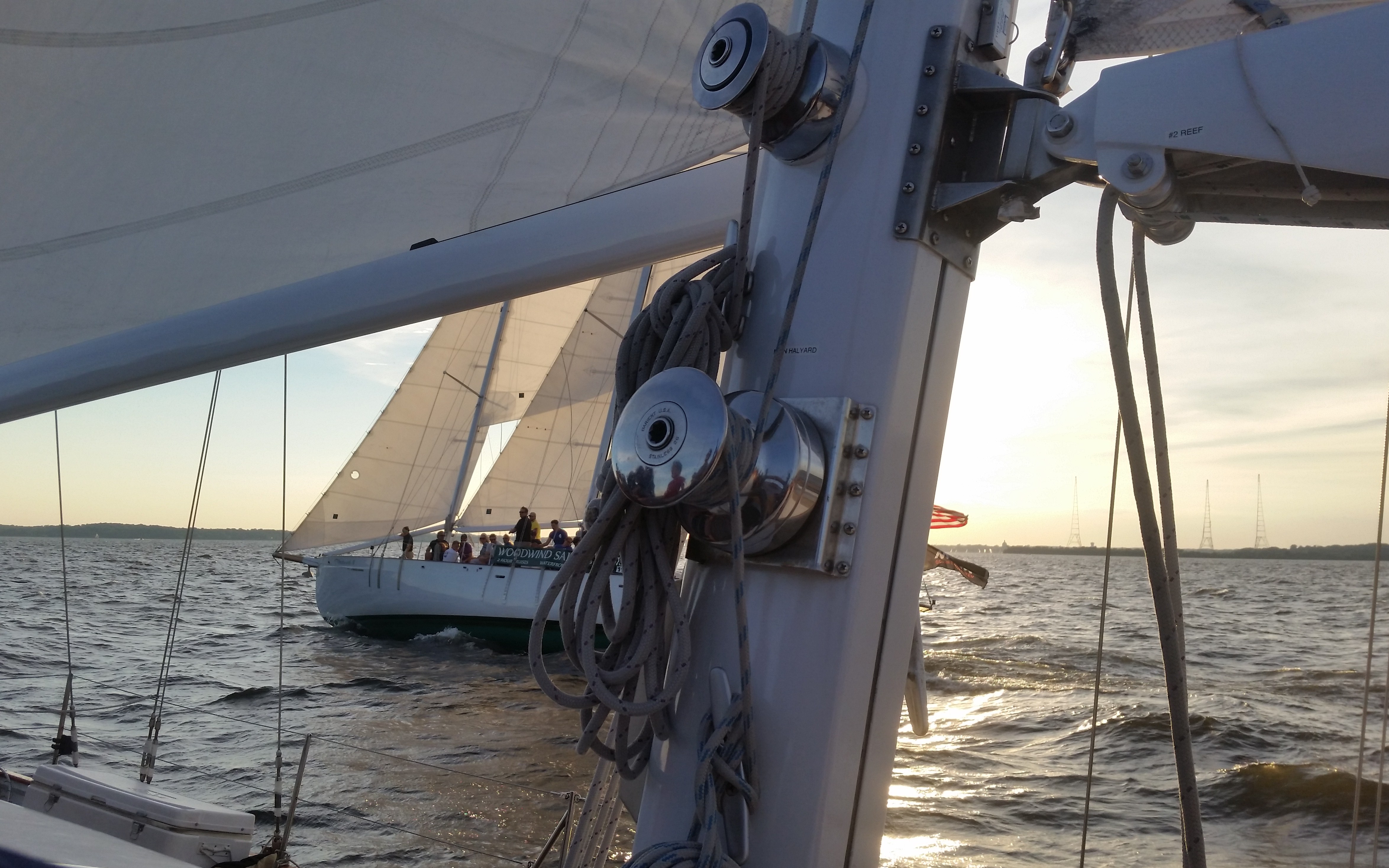 Schooners sailing side by side at dusk